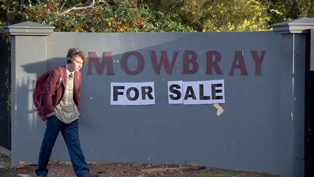 A home-made sign says it all at the bankrupt school in Melton.