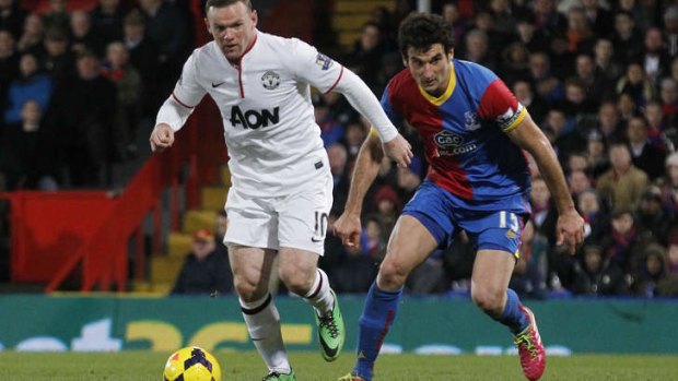 Mile Jedinak closes in on Wayne Rooney during Crystal Palace's encounter with Manchester United last month.
