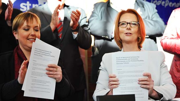 Premier Lara Giddings and Prime Minister Julia Gillard sign Tasmania up to the NDIS.