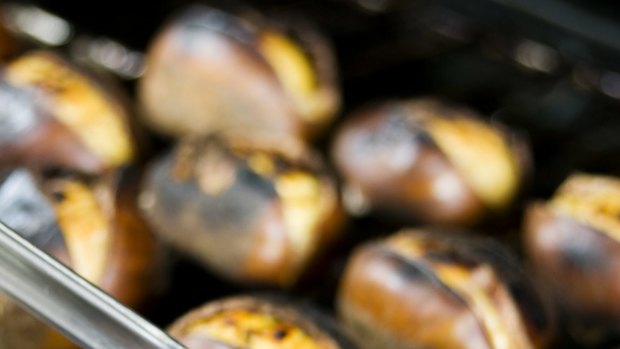 The aroma of roasted chestnuts pervades the air.