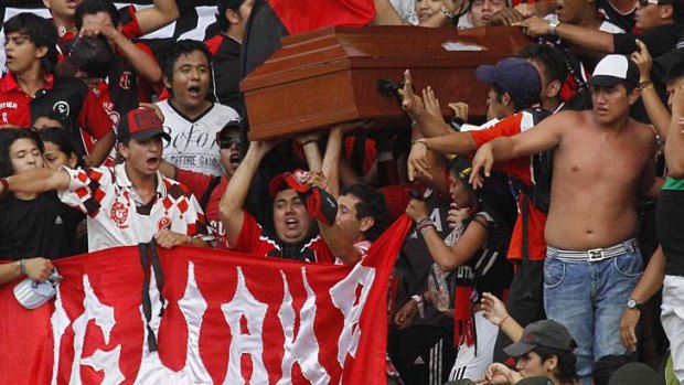 PHOTO OF THE WEEK: Fanatics of Colombian side Cucuta Deportivo "snuck" a coffin carrying the body of a teenage supporter to their game against Envigado, allowing 17-year-old Cristopher Jacome to be on hand for his team’s equalising goal.