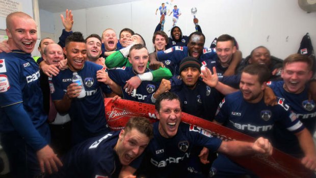 FA Cup upset ... Oldham players celebrate victory over Liverpool.