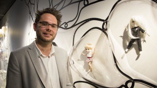 London's Design Museum curator, Alex Newson, with Makie dolls.