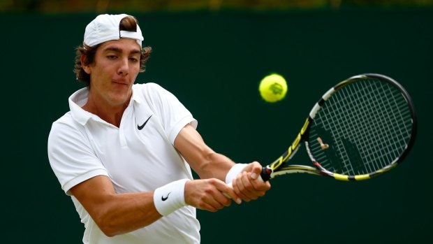 Thanasi Kokkinakis plays a backhand against Leonardo Mayer of Argentina.