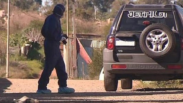 Forensic police at a home in Hope Valley, investigating how an 18-year-old received a bullet wound to the head. <i>Photo: Channel 10</i>