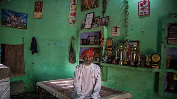 Dharam Pal Singh, a herder who regularly runs and claims to be 119 years old, with some of his running medals and trophies at home in Gudha, India, Oct. 27, 2016. An investigation in the district where Singh lives determined that he is "78 or so" years old, according to Arvind Kumar Singh, a subdivisional magistrate. (Vivek Singh/The New York Times) CREDIT LINE MUST READ: NEW YORK TIMES ATH AGE SCRUTINY 10 November 20 2016, at 04:17 PM Dharam Pal Singh, a herder who regularly runs and claims to be 119 years old, with some of his running medals and trophies at home in Gudha, India, Oct. 27, 2016. An investigation in the district where Singh lives determined that he is "78 or so" years old, according to Arvind Kumar Singh, a subdivisional magistrate. (Vivek Singh/The New York Times) - XNYT34