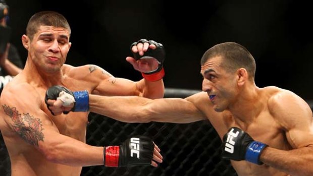 George Sotiropoulos lands a blow against Joe Stevenson during their lightweight fight in Sydney.