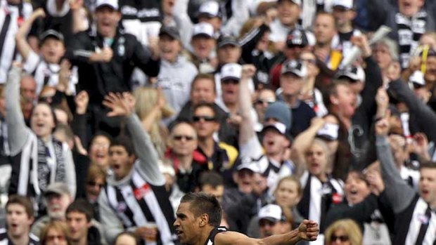 Collingwood's Andrew Krakouer celebrates kicking a goal against West Coast in the qualifying final at the MCG.
