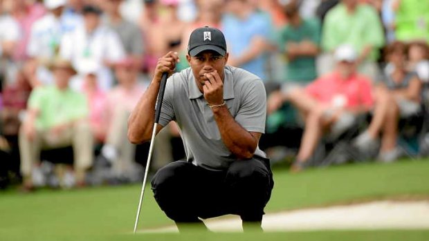Familiar terriotry: Tiger Woods needed just 30 putts to complete the first round at the US Masters.