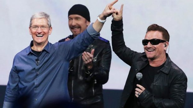 U2 with Apple CEO Tim Cook at the launch of the Apple Watch in 2014.