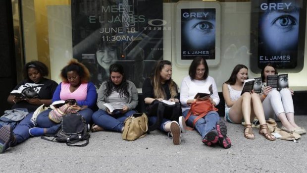 Fans wait at a <i>Grey</i> book signing in New York.