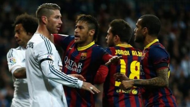Madrid captain Sergio Ramos argues with Neymar of Barcelona. Ramos would later be sent off for bringing down the striker in the penalty area.