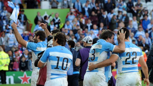 Argentina players celebrate their 54-9 win in the Rugby World Cup Pool C match against Georgia at Kingsholm, Gloucester, England.
