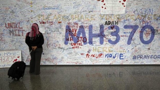 Messages for passengers aboard the missing Malaysia Airlines plane at Kuala Lumpur airport.