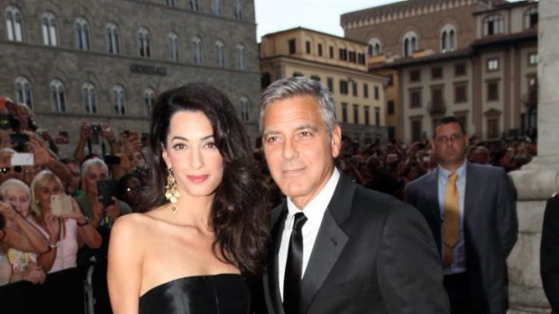 The couple stayed close during their first public outing in Italy, ahead of their wedding in the coming days.
