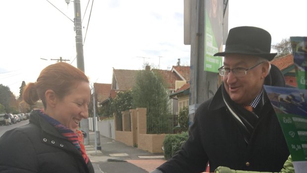 Michael Danby hands out his how to vote cards on election day.