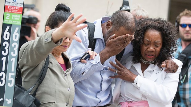 Family and friends of Valerie Castile and Philando Castile walk out of the courthouse after the verdict.