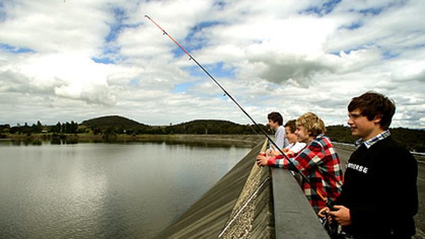 Local boys (from left) Sean Kennedy, Oscar Wiechmann, Brayden Knowles and Billy Jenkin fish at the brimming Sugarloaf Resevoir.