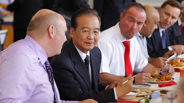 Chinese Premier Wen Jiabao lunches with employees during his visit to the MG motor plant in Birmingham.