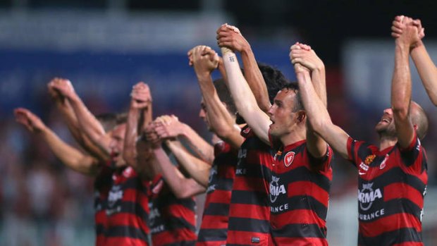 Western Sydney Wanderers players thank the crowd after the round 14 A-League match against Sydney FC at Parramatta Stadium.