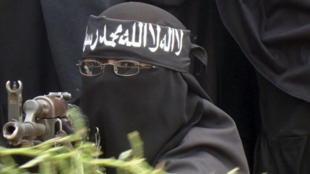 A female Al Shebab fighter  north of Mogadishu in 2010. 