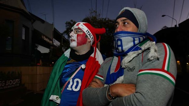 Disappointing morning ... Italy fans Maurizio Montagmese, 28, left, from Hoxton Park and Gregorio Galati, 30, from Surry Hills watch the Euro 2012 final in Norton Street, Leichhardt.
