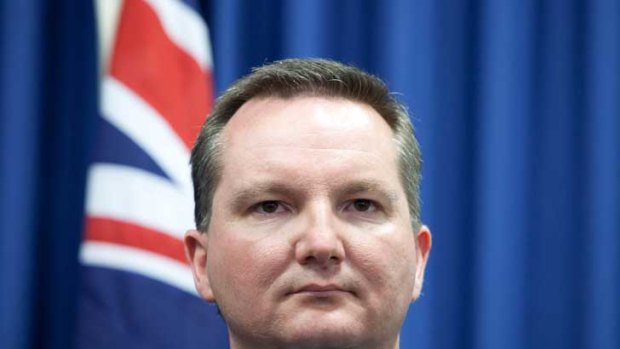 Immigration Minister Chris Bowen: Heckled and chased by protesters.