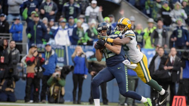 OT winner: Seattle Seahawks wide receiver Jermaine Kearse catches the game winning touchdown pass defended by Green Bay Packers cornerback Tramon Williams.