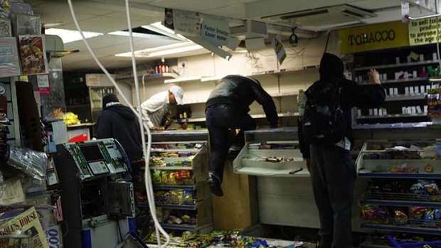 Looters rampage through a convenience store in Hackney.