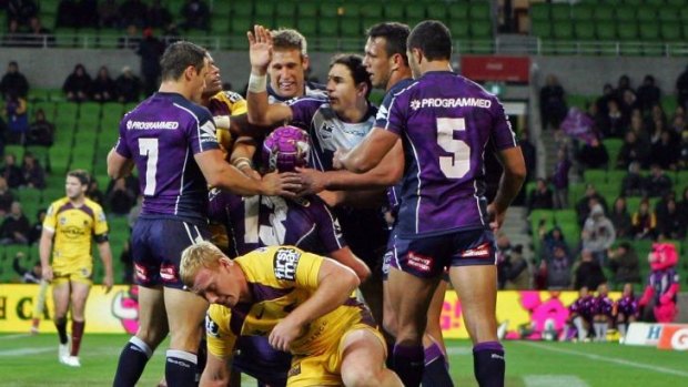 The Storm celebrate after Todd Lowrie, now a Broncos player, scores for them in 2012.