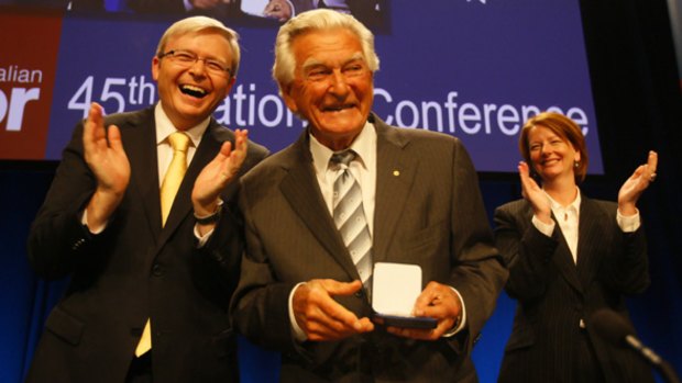 Prime Minister Kevin Rudd presents former Labor PM Bob Hawke with life membership of the ALP at the Australian Labor Party National Conference in Sydney.