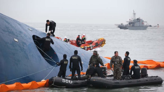 South Korean rescue team members search for passengers aboard the stricken ferry.