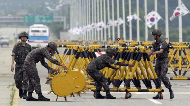 Bridges: South Korean soldiers adjust barricades at Unification Bridge near the border village of Panmunjom.