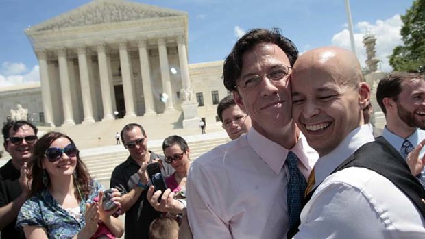 Pat Dwyer and Stephen Mosher embrace after exchanging marriage vows outside the Supreme Court building in Washington.