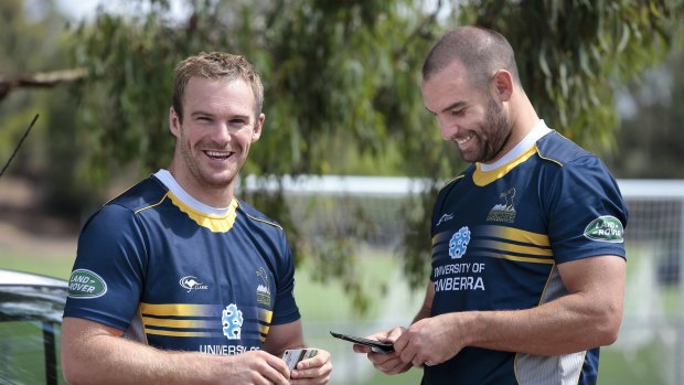 Buddies: ACT Brumbies players Pat McCabe and Scott Fardy share a laugh following a training session in 2014.