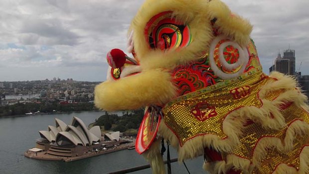 Bridging cultural gaps ... the traditional Chinese lion dance is performed on top of the Coathanger.