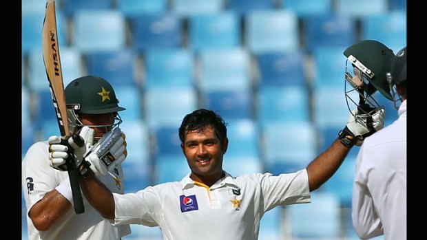 Pakistan batsman Asad Shafiq celebrates after reaching his century on the fourth day of the second Test against South Africa.