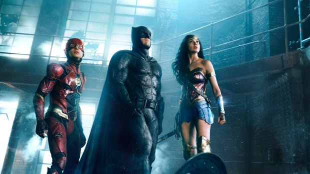 The Flash (Ezra Miller) Batman (Ben Affleck) and Wonder Woman (Gal Gadot) in Justice League.