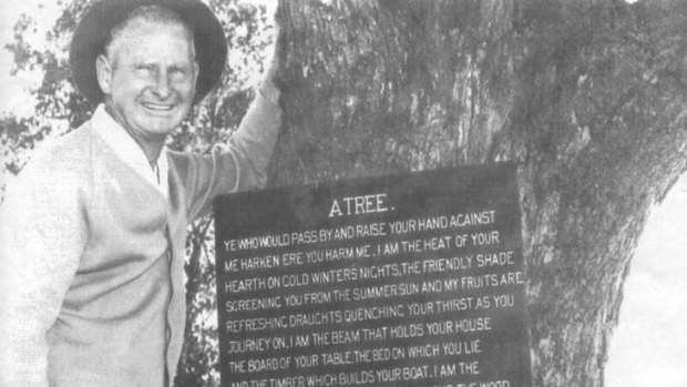 Commemorative ... Wilf Dews in the 1950s with a tree plaque, part of a program he started for BHP.