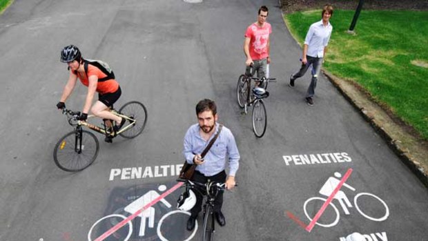 Ronan MacEwan, centre, is holding a social media event on February 26 to peacefully protest against the bicycle ban in Carlton Gardens.