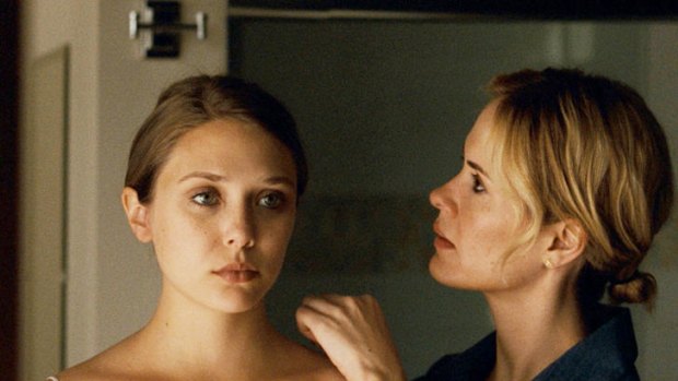 Elizabeth Olsen (left) as the troubled title character and Sarah Paulson in <i>Martha Marcy May Marlene</i>.