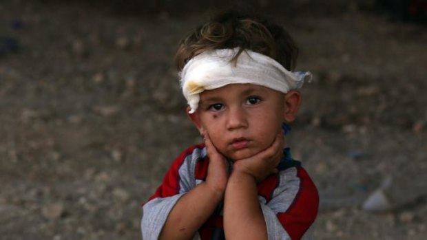 An Iraqi Yazidi child, whose family fled their home a week ago when Islamic State militants attacked the town of Sinja.