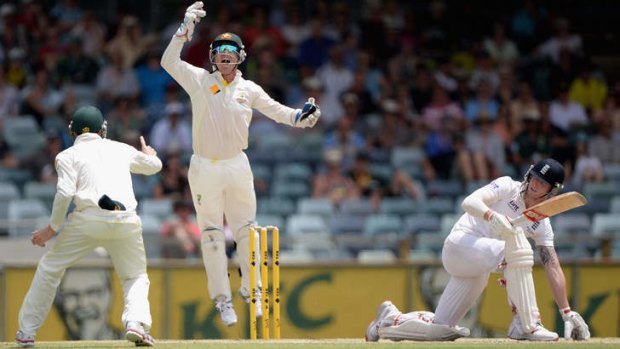 Australian wicketkeeper Brad Haddin celebrates catching out Ben Stokes of England during day five of the Third Ashes Test Match between Australia and England at WACA.