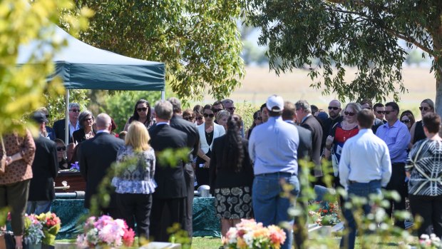  Mourners gather to lay Riharna Thomson to rest. 