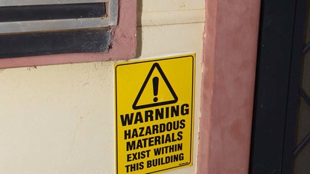 Sergeant Tony Wood returned home to find a sign near his front door: ''Warning: hazardous materials exist within this building.'' Now his young family faces an anxious wait while he searches for a safe place to live.