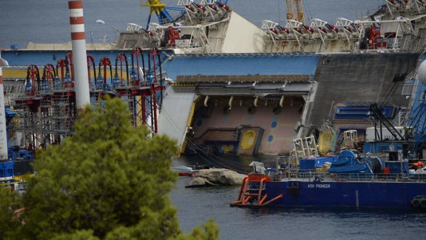 The wreck of Italy's Costa Concordia cruise ship near the harbour of Giglio Porto. Salvage workers will attempt to raise the cruise ship in the largest and most expensive maritime salvage operation in history.