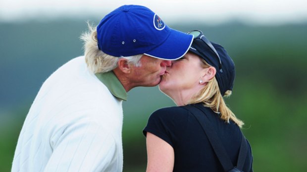 Happier times ... Greg Norman kisses Chris Evert during a practice round prior to the Open Championship at Turnberry, Scotland on July 14.