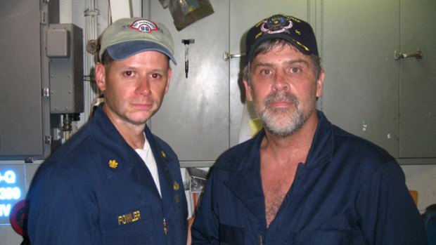 Captain Richard Phillips, right, with Lieutenant Commander  David Fowler, commanding officer of USS Bainbridge after being rescued.