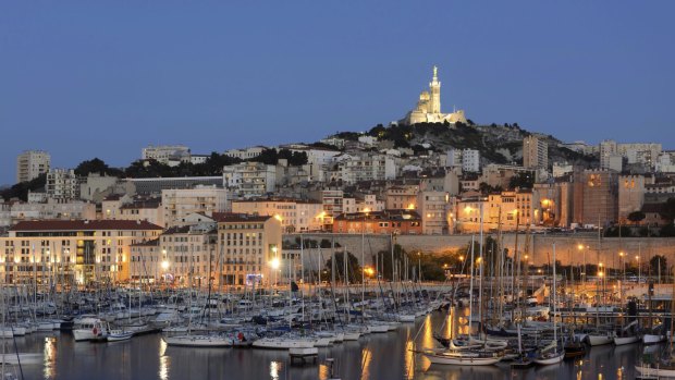 Marseille harbor with its famous Notre Dame church, France.