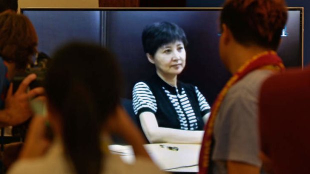 Evidence: Gu Kailai, wife of Bo Xila, at the media room for her husband's trial on Friday. Gu provided recorded video testimony corroborating evidence of bribery.